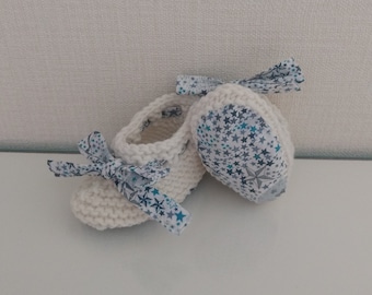 Hand-knitted baby layette slippers in white merino wool and liberty adelajda blue