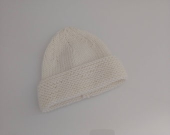 Hand-knitted foam lapel baby cap in off-white merino wool