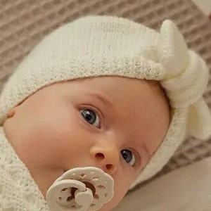 Baby turban hat with hand knitted knot in merino wool