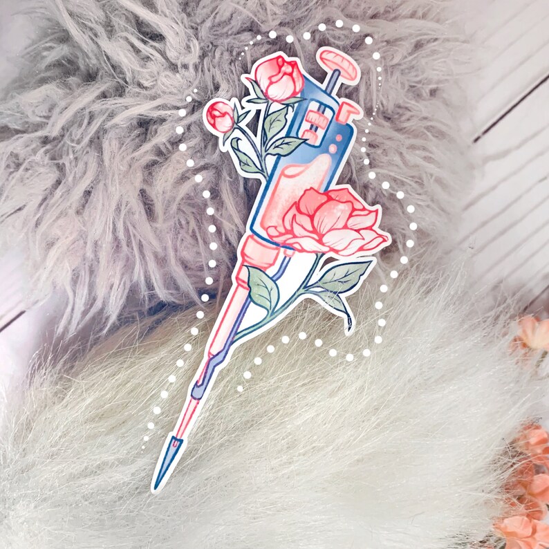 May include: A blue and white pipette with a pink flower and leaves. The pipette is surrounded by a white dotted circle.