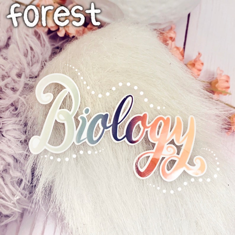 May include: A white fluffy background with a colourful sticker that says "Biology" in a cursive font.