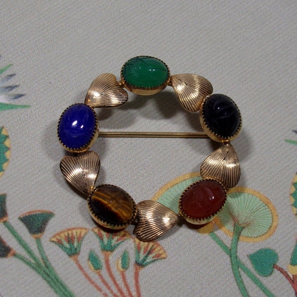 Vintage 1960s Egyptian Revival Circle Pin, Semi-Precious Carved Cabochon Stone Scarabs, Alternating with Gold Filled Leaves  Henry Griffiths