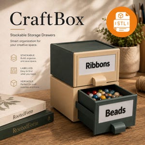 May include: A stackable storage drawer unit featuring a dark green frame and light beige drawer fronts. The top drawer is labeled Ribbons, and the bottom drawer is open, revealing colorful beads and labeled Beads. Text includes Craft Box.