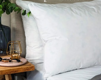 Almohadas de algodón egipcio: lujosas y suaves almohadas rellenas de fibra hueca.