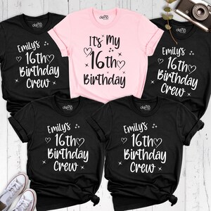May include: A selection of black and pink t-shirts with white lettering. The black shirts display "Emily's 16th Birthday Crew", while the pink one reads "It's My 16th Birthday". The t-shirts are short-sleeved.