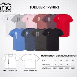 May include: Toddler t-shirt size chart with measurements in inches. The chart shows different color options for the t-shirt, including white, light grey heather, heather columbia blue, heather navy, pink, dark grey heather, heather mauve, heather maroon, black, and red.