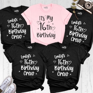 May include: Several black and pink t-shirts with white text. The black shirts display "Emily's 16th Birthday Crew", while the pink one reads "It's My 16th Birthday". The t-shirts are short-sleeved.