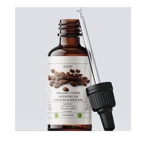 Pode incluir: Uma garrafa de vidro marrom com um conta-gotas cheia de óleo essencial de café orgânico. O rótulo diz "BADE Óleo essencial de café orgânico 100% puro e natural" e inclui os ingredientes, o método de extração e uma certificação 100% orgânica.