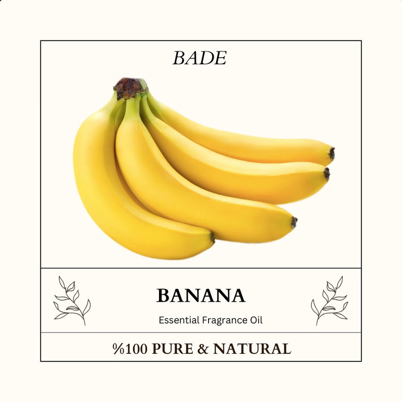 K&ouml;nnte beinhalten: Ein Bund gelber Bananen auf wei&szlig;em Hintergrund. Der Text "BADE" befindet sich oben im Bild. Der Text "BANANA Essential Fragrance Oil" befindet sich unter den Bananen. Der Text "%100 PURE & NATURAL" befindet sich unten im Bild.