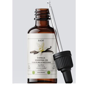 May include: A brown glass bottle with a dropper filled with vanilla essential oil. The label reads "BADE", "VANILLA ESSENTIAL OIL", "%100 PURE & NATURAL", "Ingredients: Vanilla Essential Oil", "extraction method: steam distillation", and "100% ORGANIC".