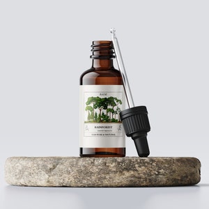 May include: A brown glass bottle with a dropper, containing Rainforest essential oil. The bottle is labeled with the brand name "RADI" and the text "Rainforest Essential Fragrance Oil 100% Pure & Natural".