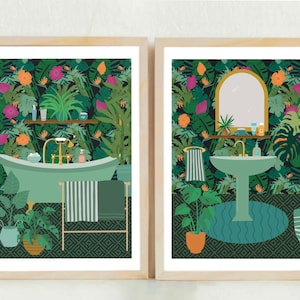 May include: Two framed illustrations of a bathroom with a tropical theme. The first illustration shows a bathtub with a green and white striped towel hanging on a rack. The second illustration shows a sink with a round mirror above it. Both illustrations feature a green and black patterned background with tropical plants and flowers.
