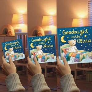 May include: A children's book titled "Goodnight Little Olivia" with a blue cover featuring a teddy bear in pajamas on a bed. The cover also includes a crescent moon, stars, and the title in white and yellow.