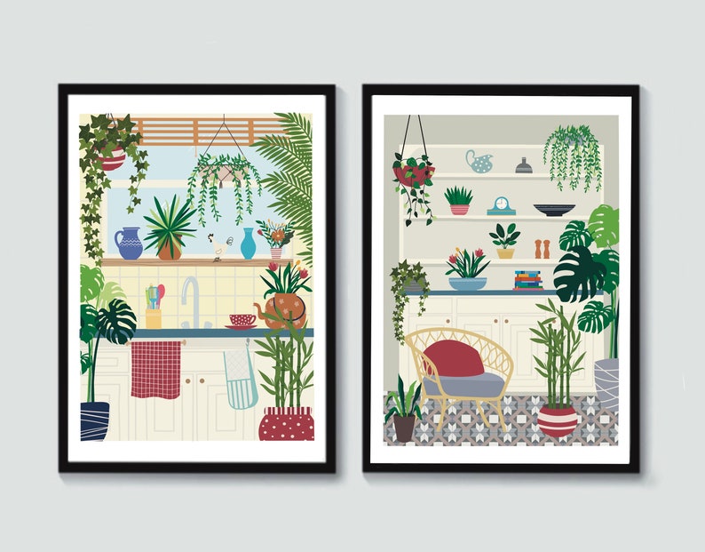 May include: Two framed illustrations of kitchens with a variety of plants and greenery. The first image shows a kitchen sink with a red and white checkered dish towel. The second image shows a kitchen with a wicker chair and a patterned tile floor.