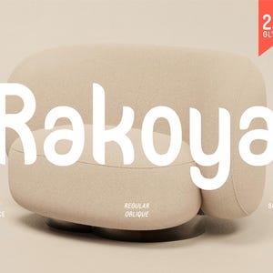 May include: A beige, modern-style armchair with rounded edges and a low profile. The word "Rakoya" is prominently displayed in large, white, sans-serif font. Additional text includes "Display Typeface," "Regular Oblique," and "Salamah Type," along with "223 Glyphs."