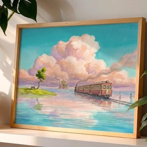 May include: A framed watercolor painting depicts a train traveling on tracks across water, with a small island and large, fluffy clouds in the sky. The train is red and yellow, and the sky is a mix of blue and pink.