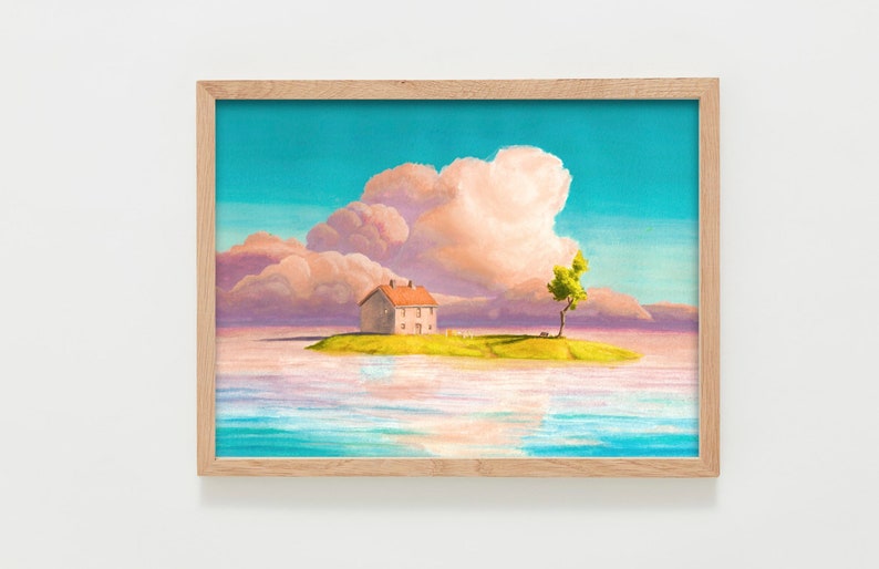 May include: Framed art print showing a tranquil scene. A small house with a red roof is on a grassy island, with a tree and bench. The sky is a gradient of blue and pink, with fluffy clouds and water in the foreground.
