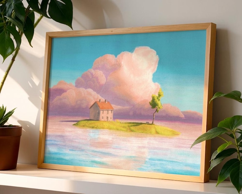 May include: A framed art print showing a tranquil landscape. A small house with a red roof is on a grassy island, with a tree. The sky is a gradient of blue and pink, with fluffy clouds. The water reflects the sky and island.