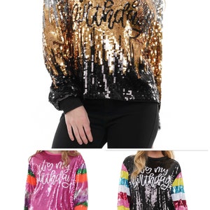 May include: Three long-sleeved sequined shirts with the text "It's my birthday" on the front. The shirts are in black, pink, and rainbow colors.