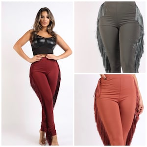 May include: Three pairs of leggings with fringe detailing. The leggings are in burgundy, gray, and rust colors.