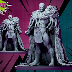 May include: A gray painted miniature figurine of a muscular figure wearing a cape with a lion head on the shoulder. The figure is standing on a gray base.