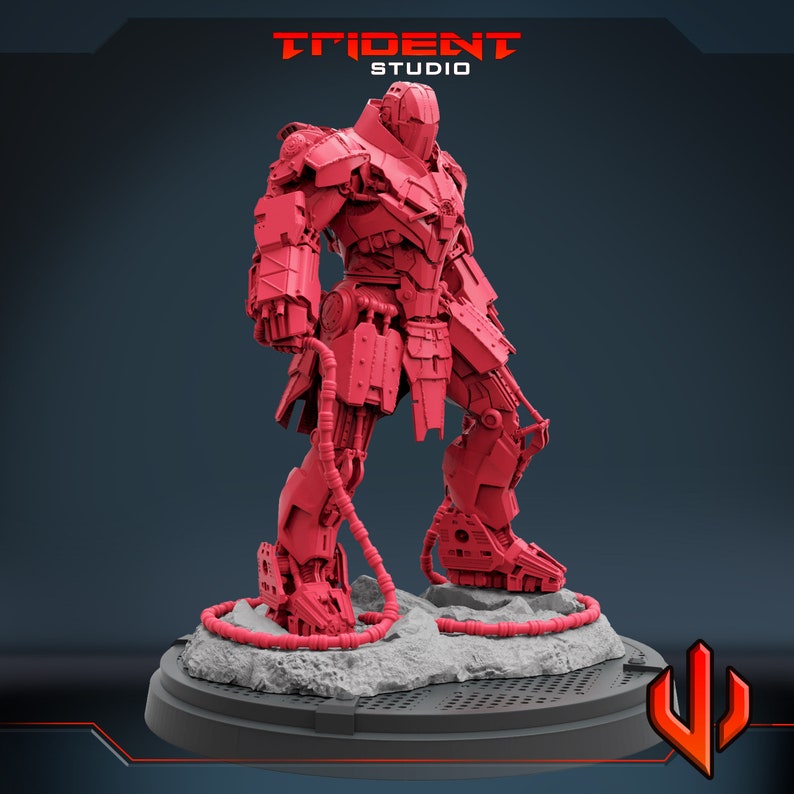 May include: A red, detailed, articulated robot figure standing on a gray base with a black grid pattern. The robot has a large head with a helmet and a body with many mechanical parts. The robot is holding a long, thin cable in its right hand.