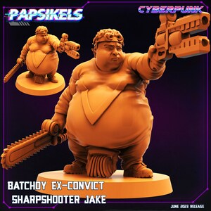 May include: A 3D printed miniature of a large, orange-coloured character holding a chainsaw in one hand and a futuristic gun in the other. The character is wearing a yellow jumpsuit with a V-shaped design on the chest. The miniature is labelled "Batchoy Ex-Convict Sharpshooter Jake" and "Cyberpunk".