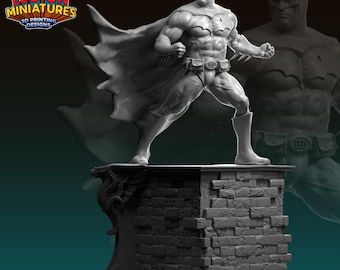 May include: A gray 3D printed miniature of Batman standing on a brick base. The figure is posed in a dynamic action stance with his cape flowing behind him. The base features a gargoyle design.