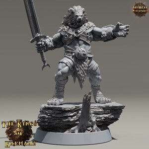 May include: A gray, detailed miniature figurine of a lion-headed warrior holding a sword. The warrior is standing on a rocky base with a tree stump. The miniature is part of the "The Kings of Karmaaz" collection.
