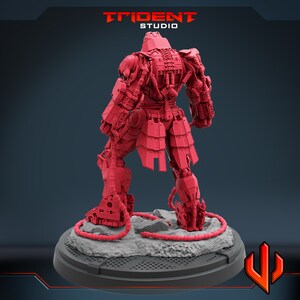 May include: A red 3D printed model of a robot with a samurai-inspired design. The robot is standing on a circular base with a textured surface. The robot has a detailed design with many intricate parts. The model is printed in a bright red color.