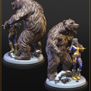 May include: A brown bear figurine with a detailed fur texture, standing next to a female character in a blue and yellow costume. The figurine is on a white base. The text "TURNAROUND" is at the top.