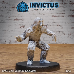 May include: A gray, furry, humanoid figure with a gas mask and a woven chest piece. The figure is posed in a crouching position with its arms outstretched. The figure is standing on a black base. The base is labeled "BASE SIZE: MEDIUM (25.5MM)" and "#714".