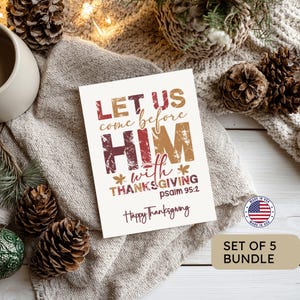 May include: A rectangular greeting card with a white background featuring the text Let us come before Him with thanksgiving Psalm 95:2 and Happy Thanksgiving in maroon and tan colors. The card is decorated with small leaf icons and distressed lettering.