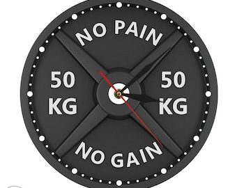 Può includere: Orologio a forma di piastra di peso nero con testo bianco che recita "No Pain No Gain" e "50 KG" su entrambi i lati. Le lancette dell'orologio sono nere e rosse.