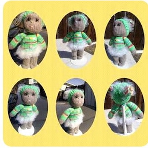 May include: A hand-knitted gray and green doll with a white fur trim and a green hat. The doll is wearing a green and gold striped sweater and a white skirt.