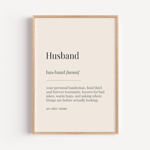 May include: A printable definition of the word "Husband" in a beige frame. The definition reads: "your personal handyman, food thief, and forever teammate. Known for bad jokes, warm hugs, and asking where things are before actually looking. See also: name."