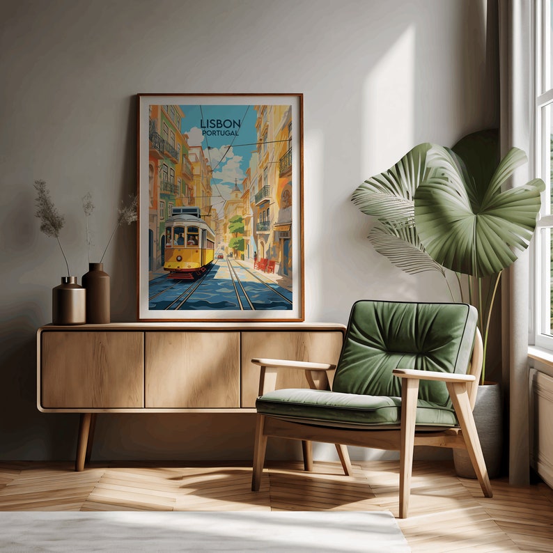 May include: A vintage-style poster featuring a yellow tram traveling down a street in Lisbon, Portugal. The poster has a blue sky with white clouds and colorful buildings on either side of the street.