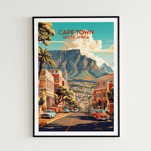 May include: A vintage travel poster featuring a colorful illustration of Cape Town, South Africa. The poster depicts a street scene with buildings, palm trees, and cars, with Table Mountain in the background. The text "CAPE TOWN SOUTH AFRICA" is printed at the top of the poster.