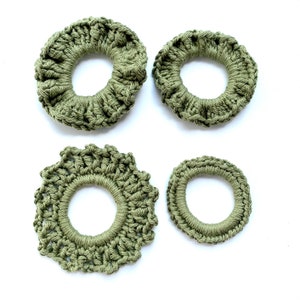 May include: Four green crocheted hair scrunchies of different sizes and styles.