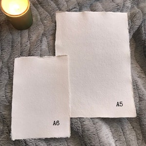 May include: Two pieces of white paper, one labeled "A5" and the other labeled "A6".