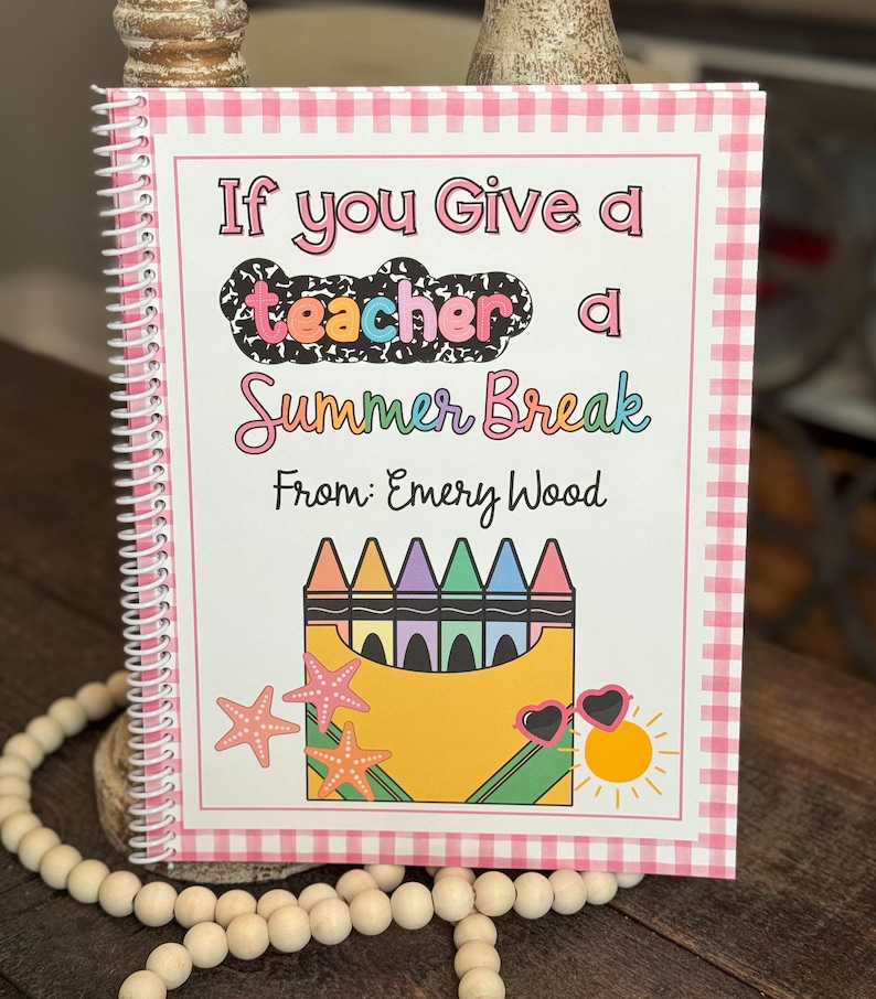 May include: Spiral-bound notebook with a pink and white gingham border. The cover features the text "If you Give a teacher a Summer Break" with crayon and summer-themed illustrations. The notebook is personalized "From: Emery Wood".
