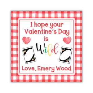 May include: A red and white checkered background with a white card featuring two UNO Wild cards and the text "I hope your Valentine's Day is Wild. Love, Emery Wood".