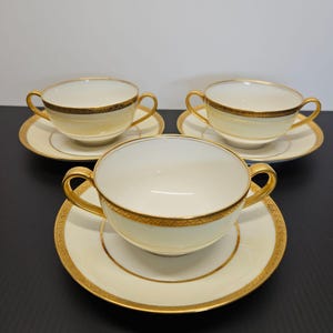 Tazas y platillos Boullion con banda blanca y crema de Theodore Haviland Limoges con incrustaciones doradas