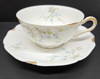 Conjunto de xícara e pires C Ahrenfeldt Limoges Depose com flores azuis e cinzas