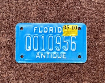 Florida Antique Motorcycle License Plate: White on Blue # Q010956