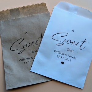 May include: Two paper bags with an "A Sweet Treat" design. The bags are brown and white and have the text "William & Nicole 13.11.2011" printed on them.