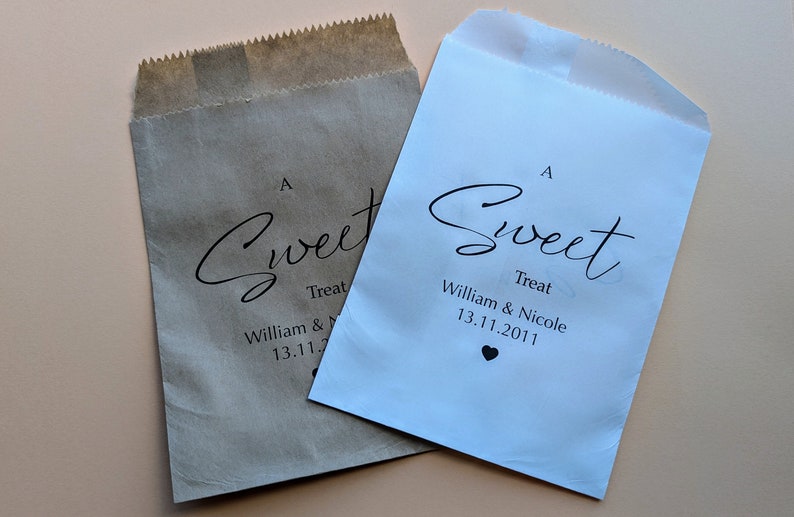 May include: Two paper bags with an "A Sweet Treat" design. The bags are brown and white and have the text "William & Nicole 13.11.2011" printed on them.