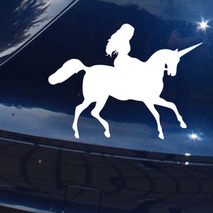 Sticker Fille de rêve à cheval avec une licorne fantastique
