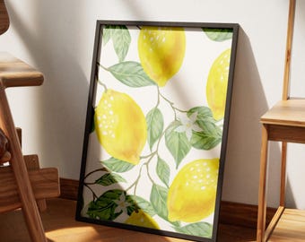 May include: Framed art print featuring a watercolor illustration of lemons and leaves. The lemons are yellow with white speckles, and the leaves are green. The artwork is set against a cream-colored background and framed in black.