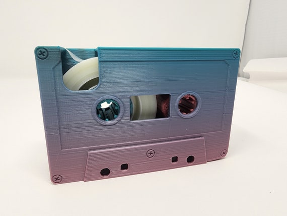 Tape dispenser cassette outlet